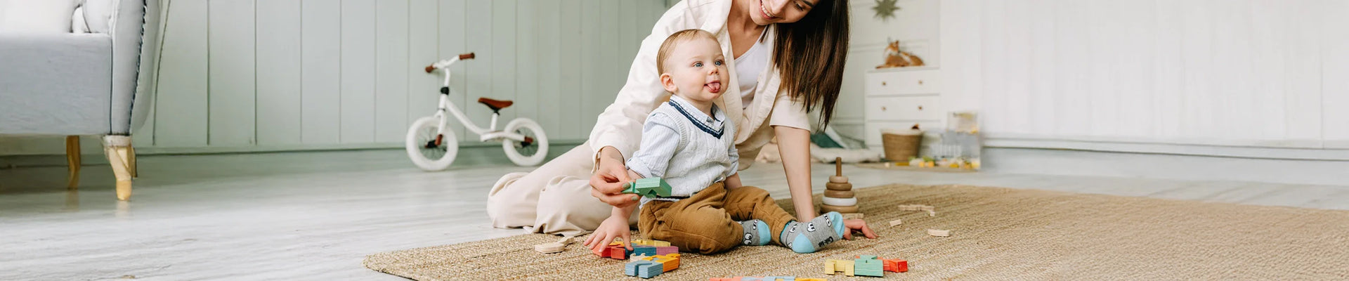 Personalised organic cotton blanket and Montessori busy board from Govinto UK